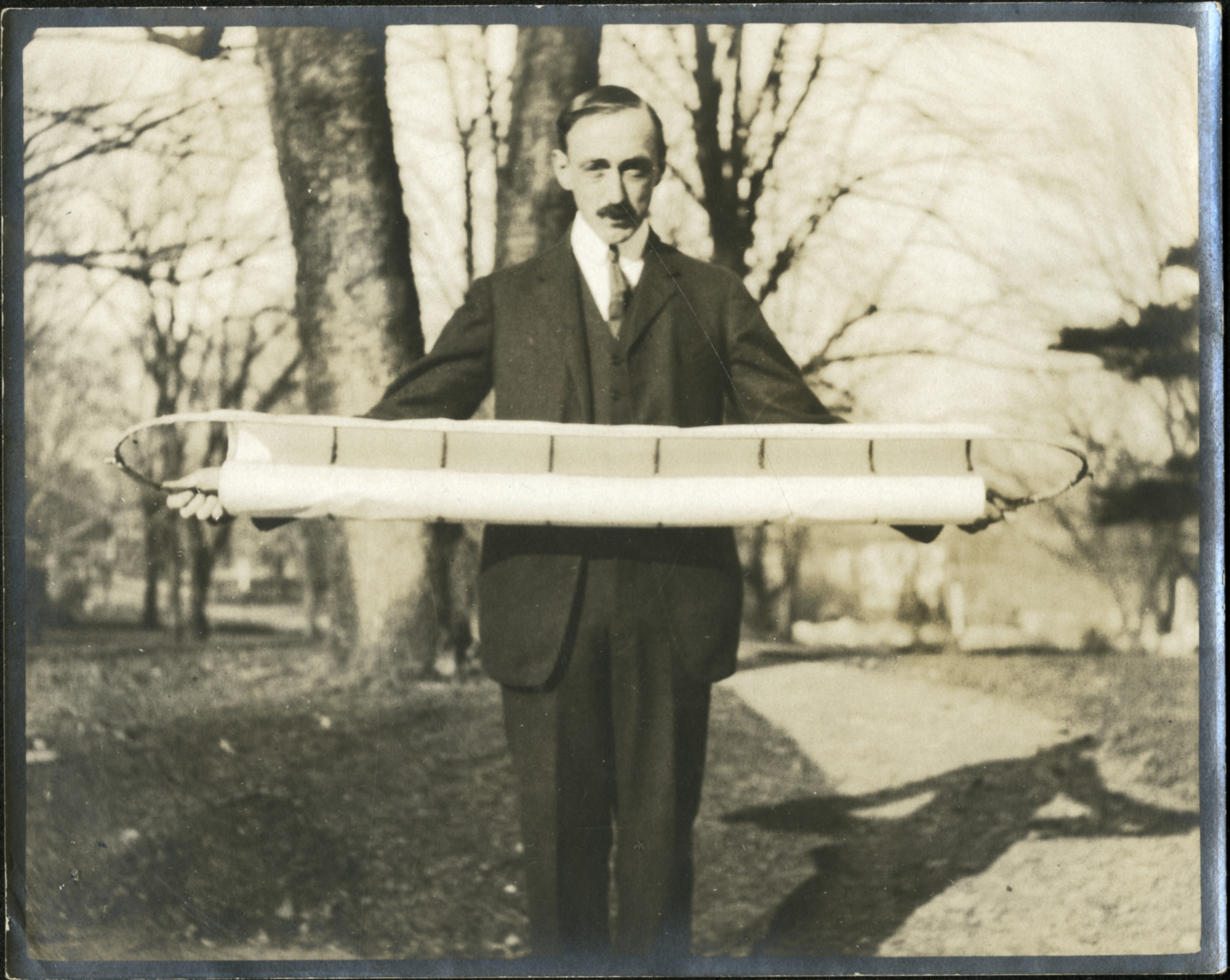 man holding a horizontal object